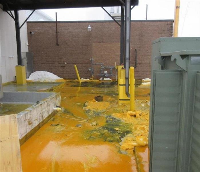 Picture of Factory Floor with Orange Juice all over it