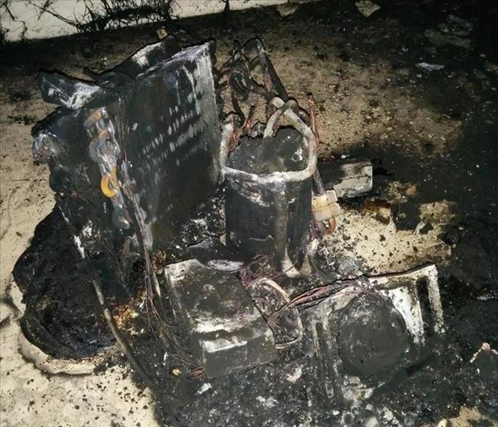 Picture of what's left of a dehumidifier after it caught fire